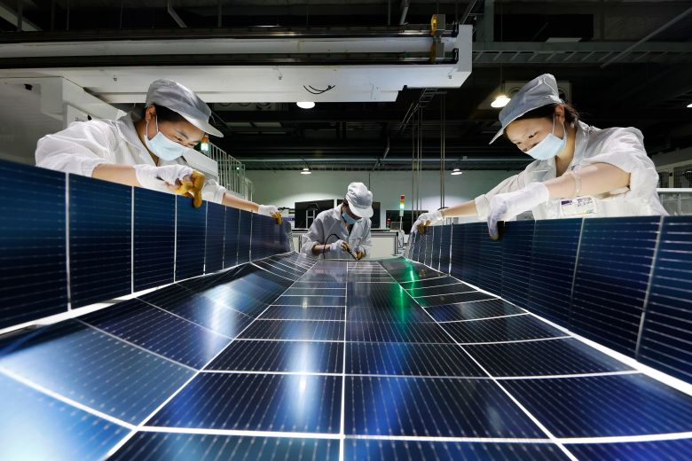 Workers manufacture photovoltaic modules in Suqian City, Jiangsu Province, China, in July 2025. Saudi Arabia was among the top importers of Chinese solar panels last year.