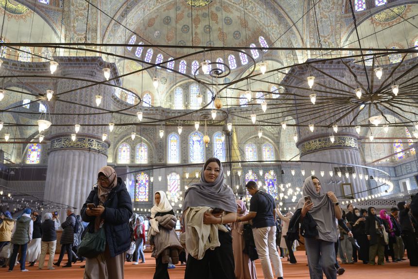 Tourists visit Sultan Ahmed Mosque, also known as the Blue Mosque, ahead of the visit of Pope Leo XIV to Turkey.