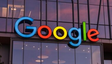 A large Google logo on the outside of a company building.