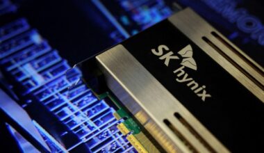 Close-up of an SK Hynix semiconductor product with the company logo visible, displayed against a blue circuit board background.