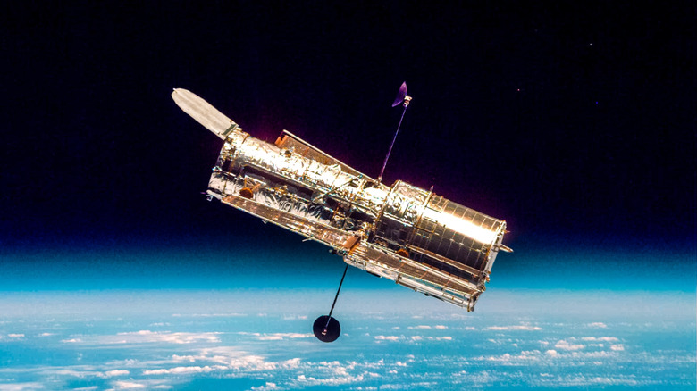 Hubble space telescope pictured over Earth
