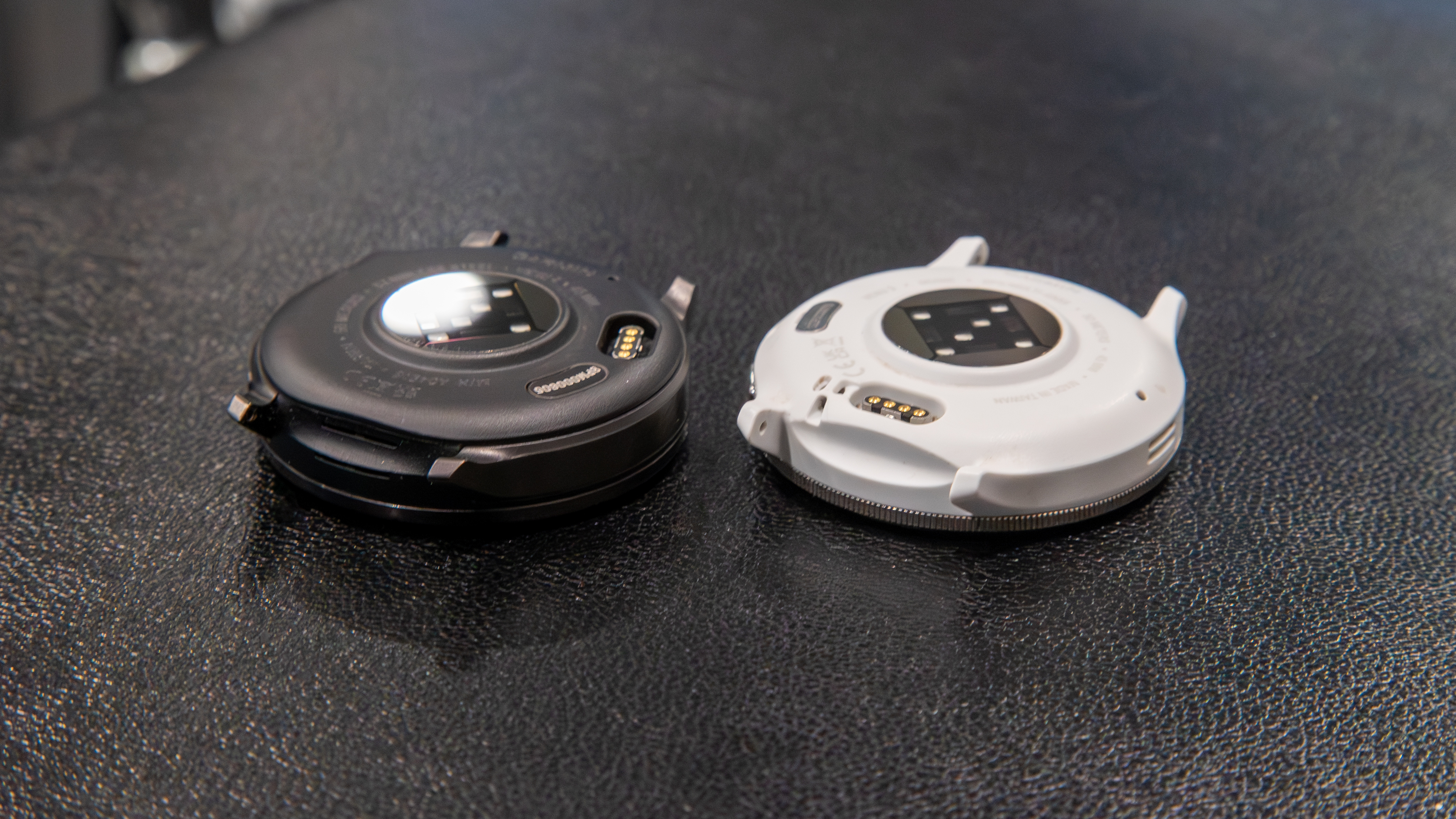 Garmin Venu 4 next to the Venu 3 face down
