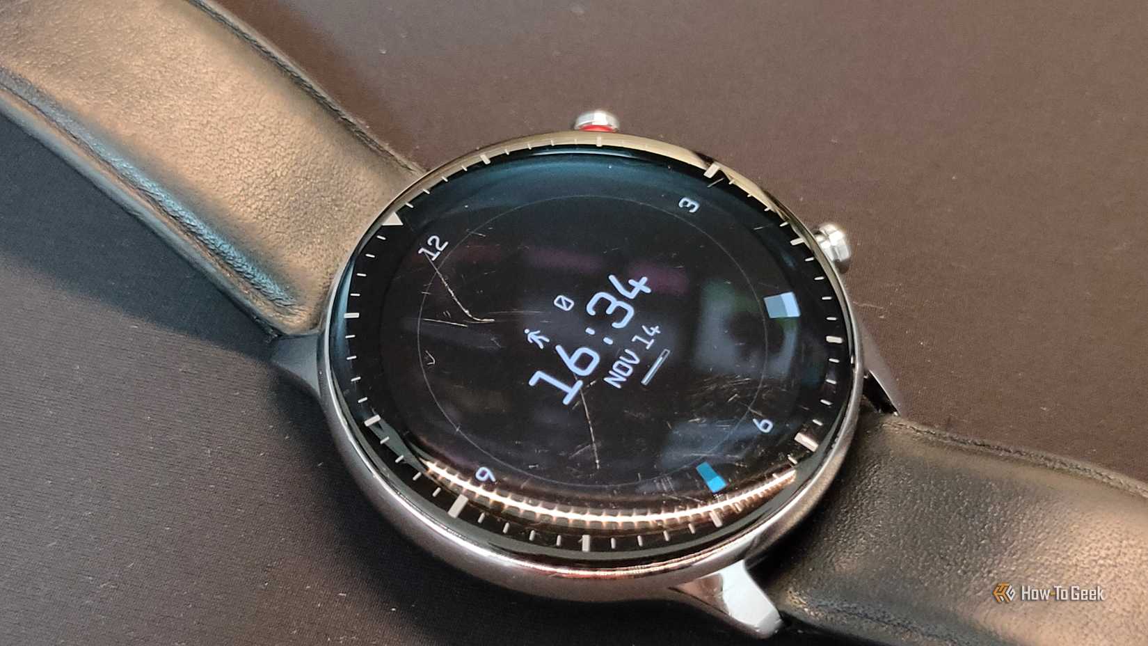 A close-up of a scratched smartwatch display.