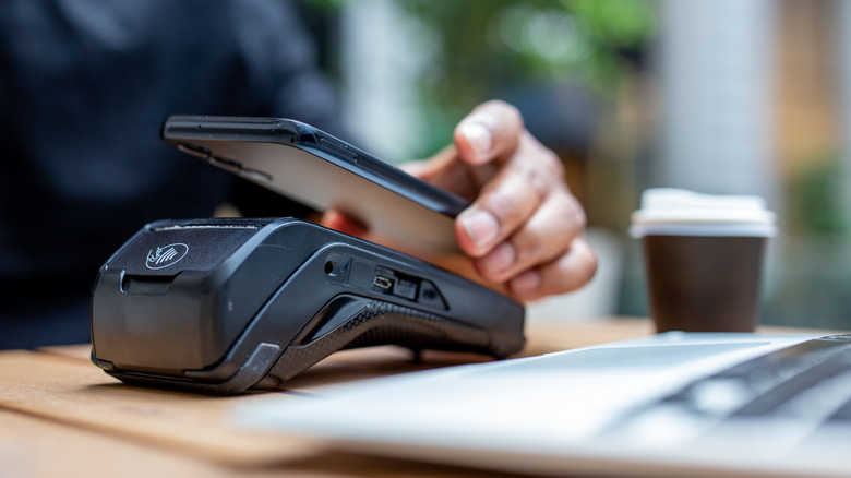 Digital credit and mobile app payments used at register.