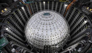 Photo of the large sphere of the central detector of the Jiangmen Underground Neutrino Observatory