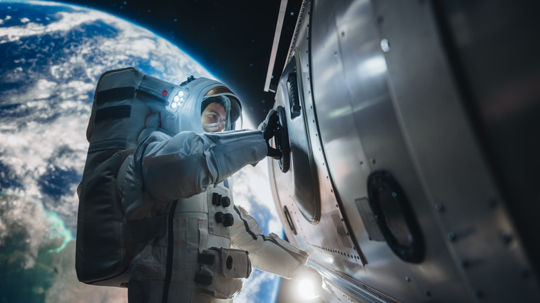 An astronaut working on the exterior of a spacecraft.