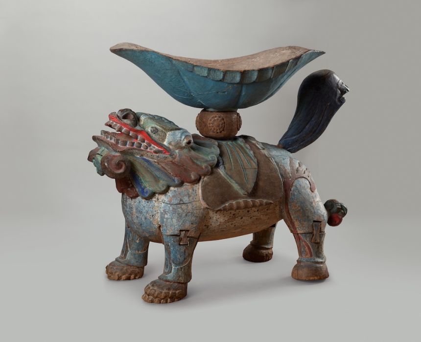 A painted wooden drum stand dating to the 19th century.