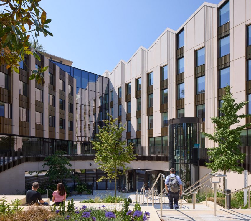 People walking outside educational building by NBBJ