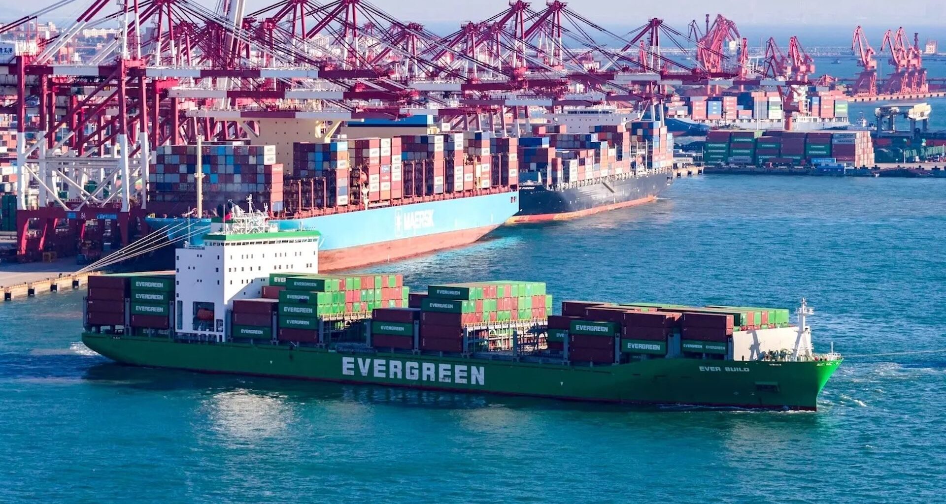 a photo of a container ship near a port