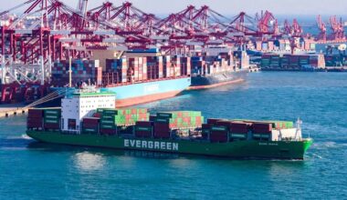 a photo of a container ship near a port