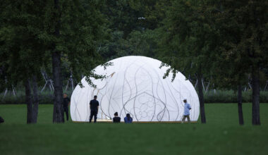 translucent illuminating dome bears bronze lattice of flower motifs in shanghai