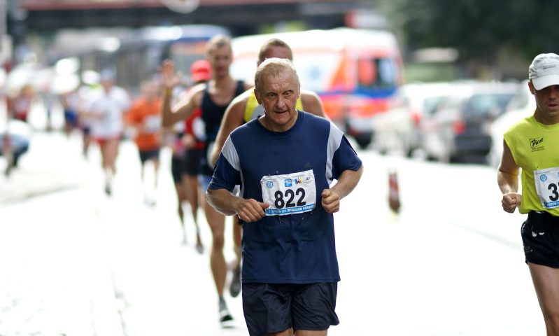 older man running marathon
