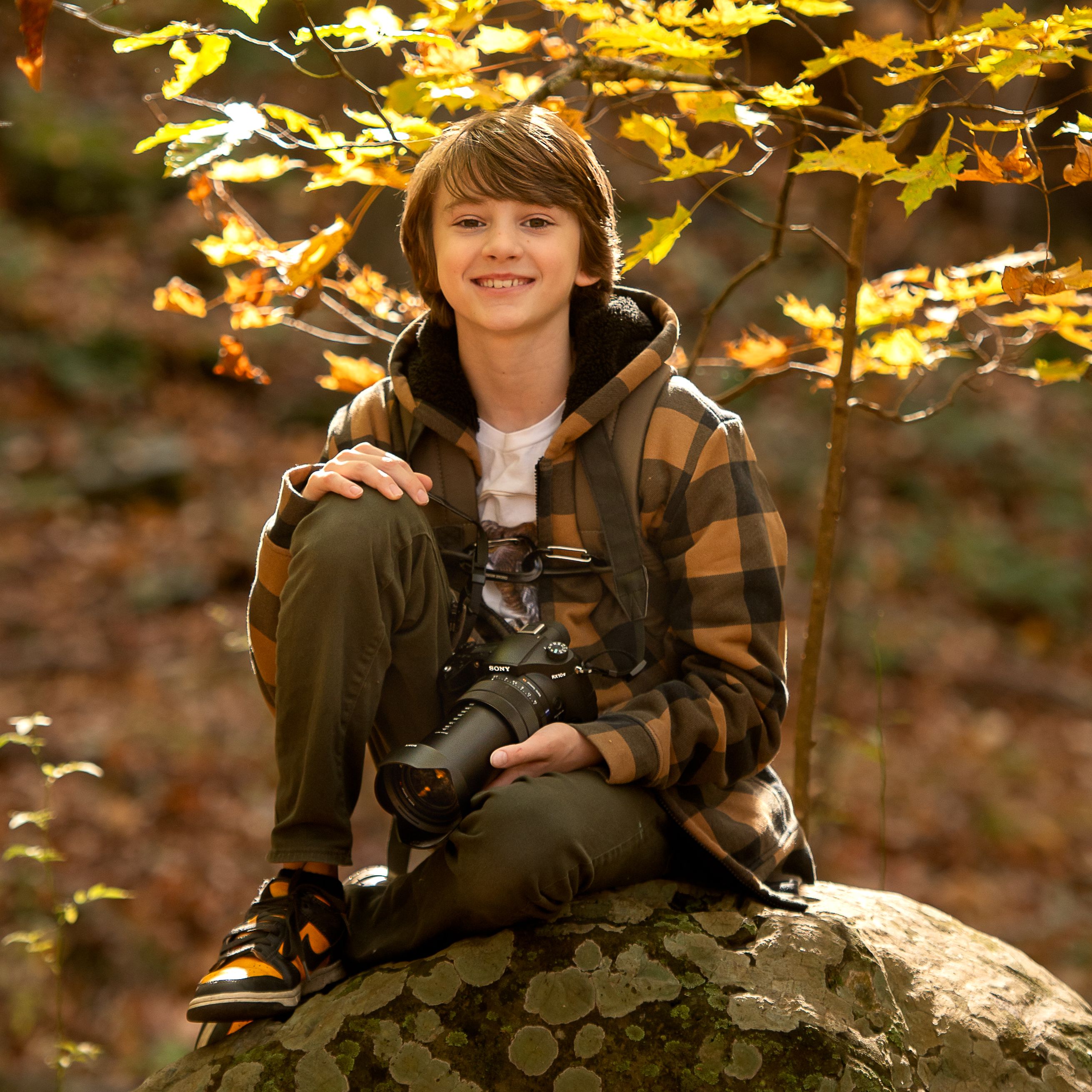 A photograph of Tyler DeVane holding the Sony RX10 IV