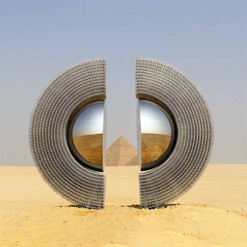 reflective aluminum sculpture by mert ege köse splits apart to frame the giza pyramids