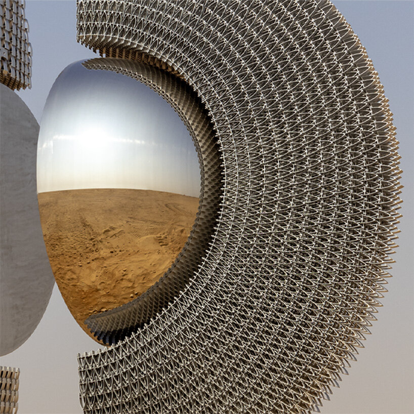 reflective aluminum sculpture by mert ege köse splits apart to frame the giza pyramids