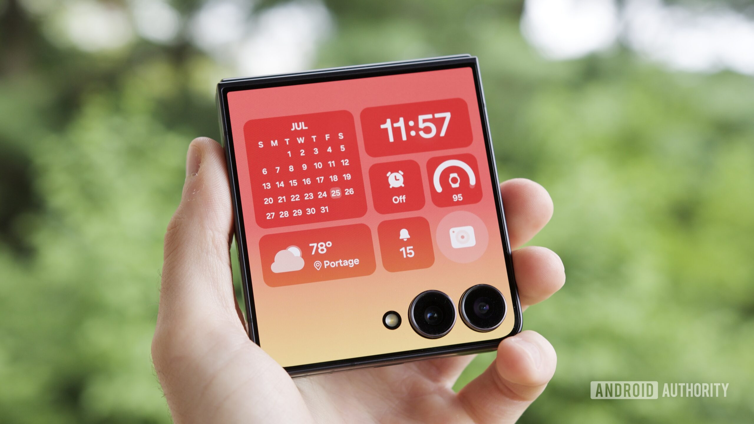 Someone holding a Galaxy Z Flip 7 with its cover screen on.