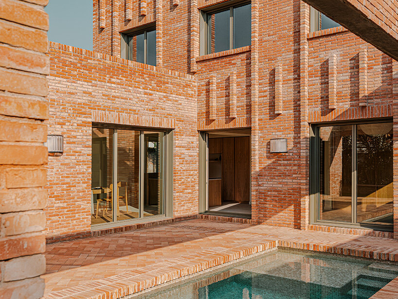 SIGLA studio organizes brick residence around two 'lungs' of light in spain