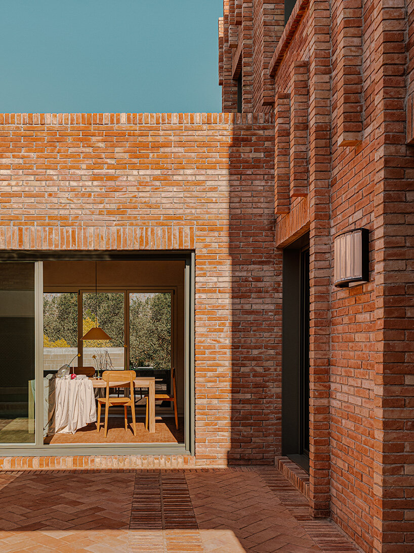 SIGLA studio organizes brick residence around two 'lungs' of light in spain