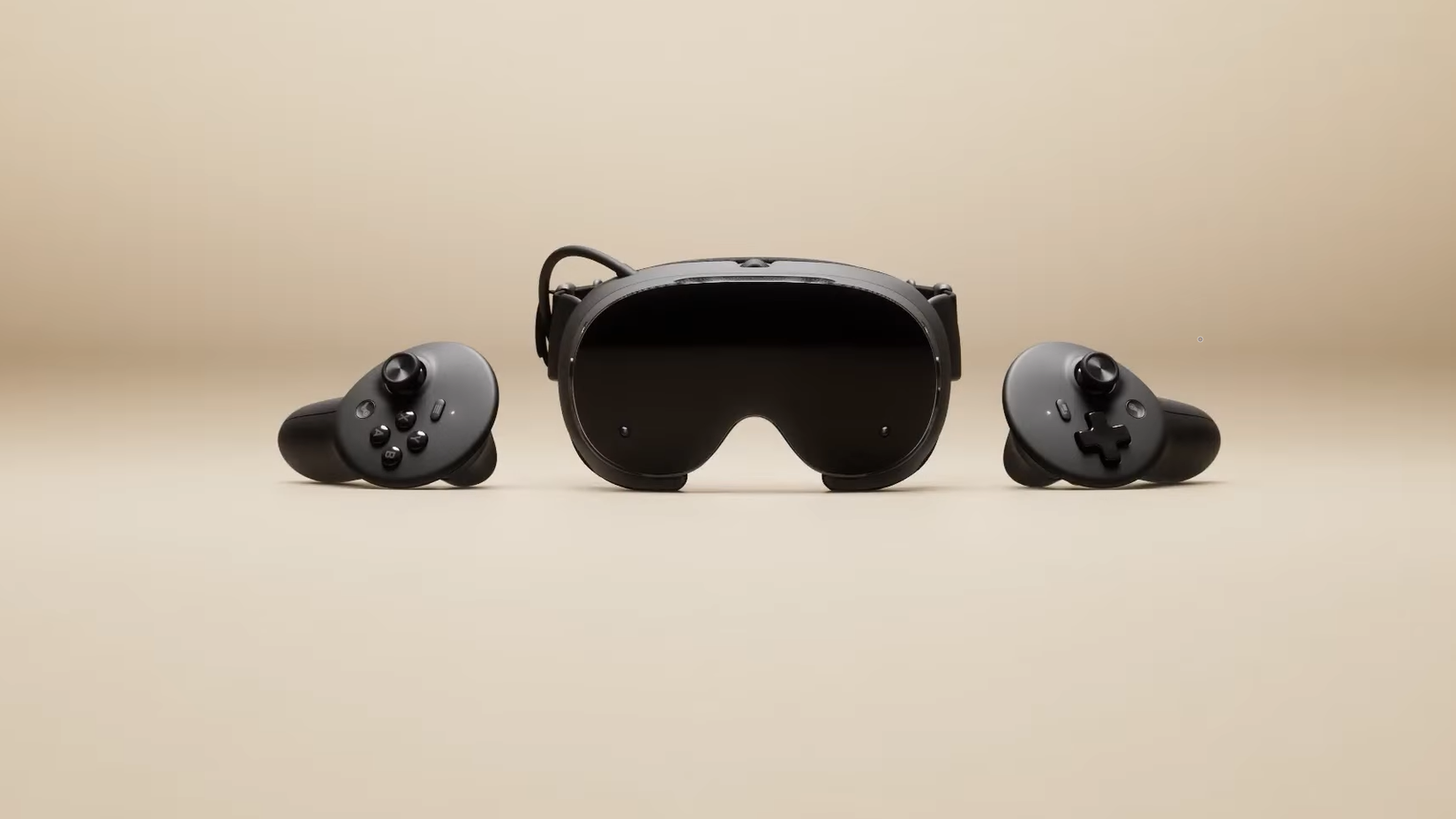 A black VR headset next to two wireless controllers