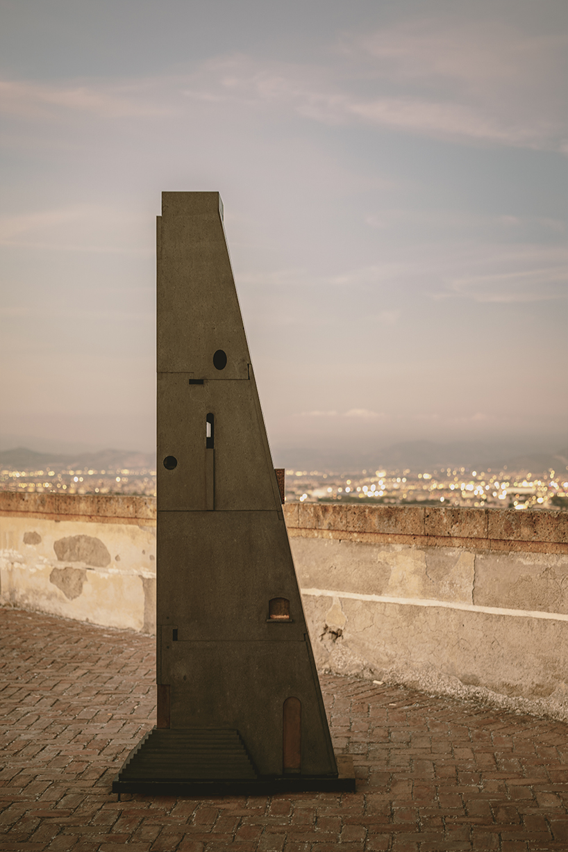 totemic sculptures compose volcanic stone landscape for site-specific installation in naples