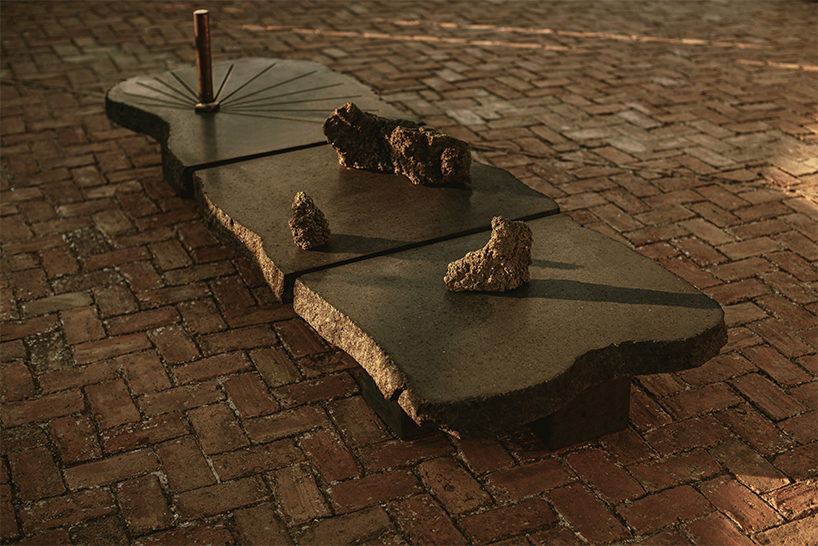 totemic sculptures compose volcanic stone landscape for site-specific installation in naples