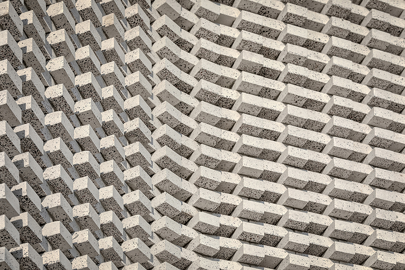 porous white brickwork facade enfolds renovated 1980s terrace house in kuala lumpur