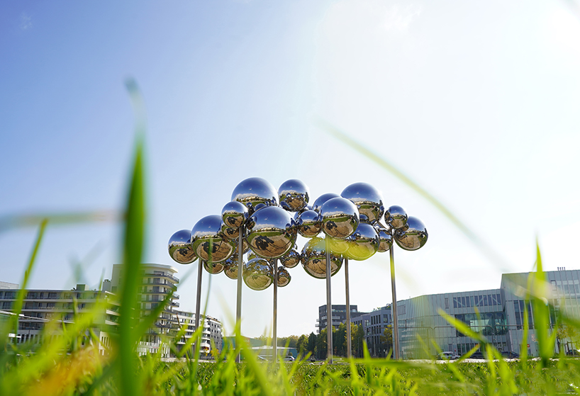 mirrored steel bubbles shape suspended kinetic sculpture by vincent leroy in normandy