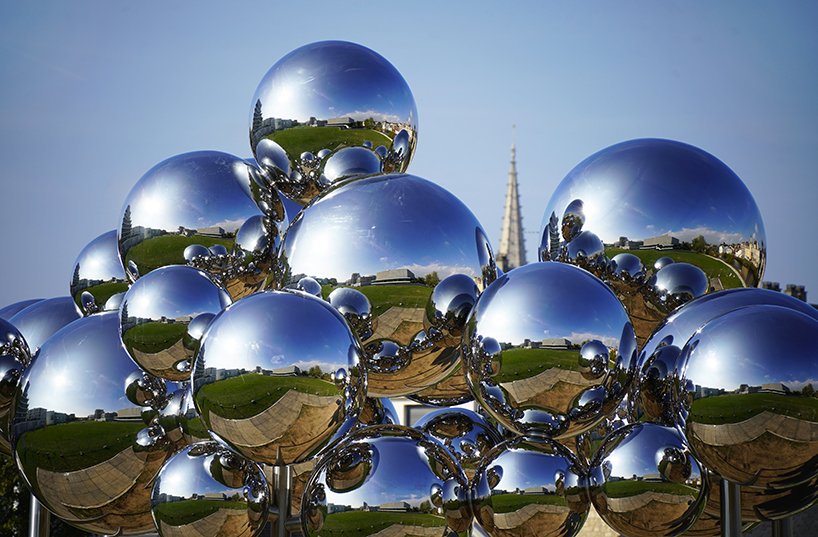 mirrored steel bubbles shape suspended kinetic sculpture by vincent leroy in normandy
