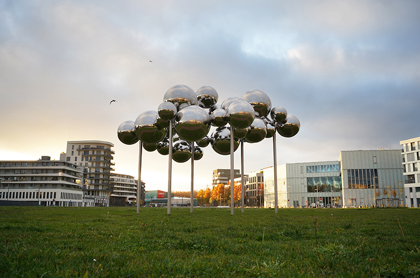 mirrored steel bubbles shape suspended kinetic sculpture by vincent leroy in normandy
