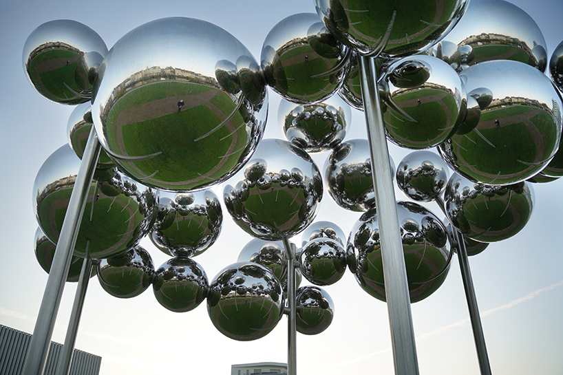 mirrored steel bubbles shape suspended kinetic sculpture by vincent leroy in normandy