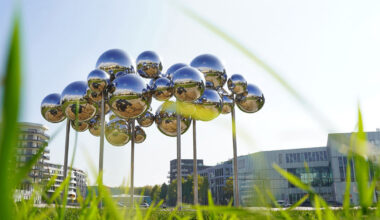 mirrored steel bubbles shape kinetic sculpture by vincent leroy in normandy