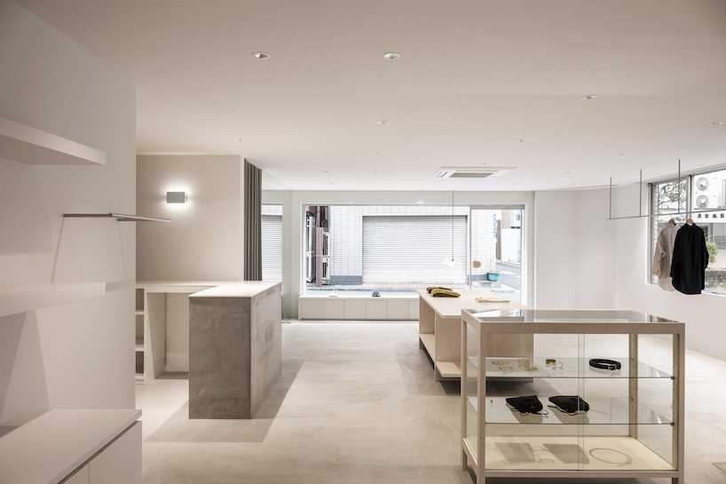 white-stained wood shapes soft bright interiors for tokyo apparel store