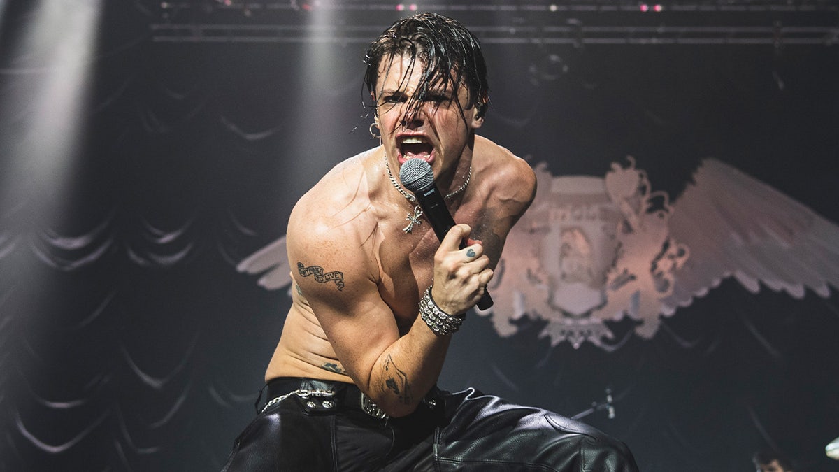 Yungblud sings shirtless on stage
