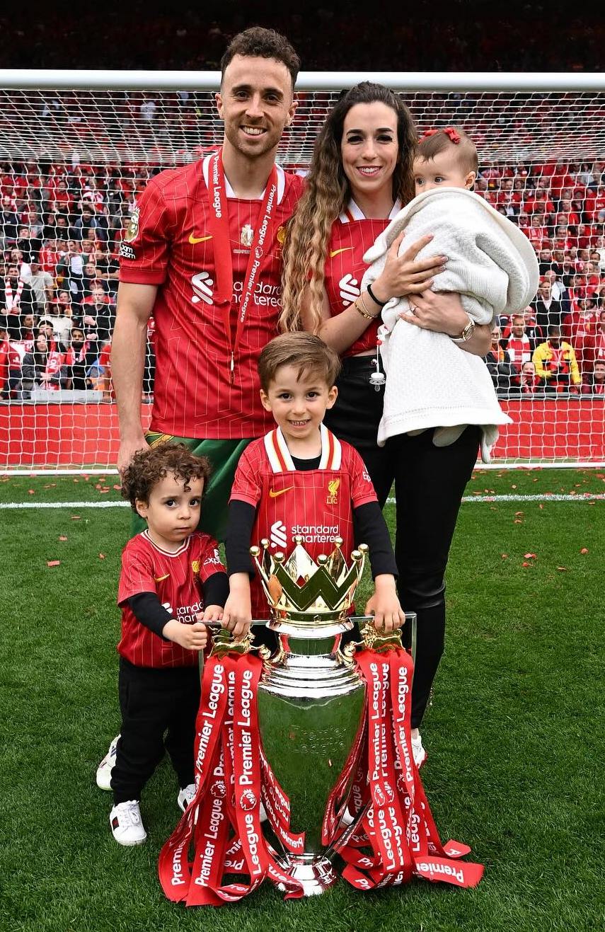 Diogo Jota and wife Rute Cardoso with their children, holding the Premier League trophy.
