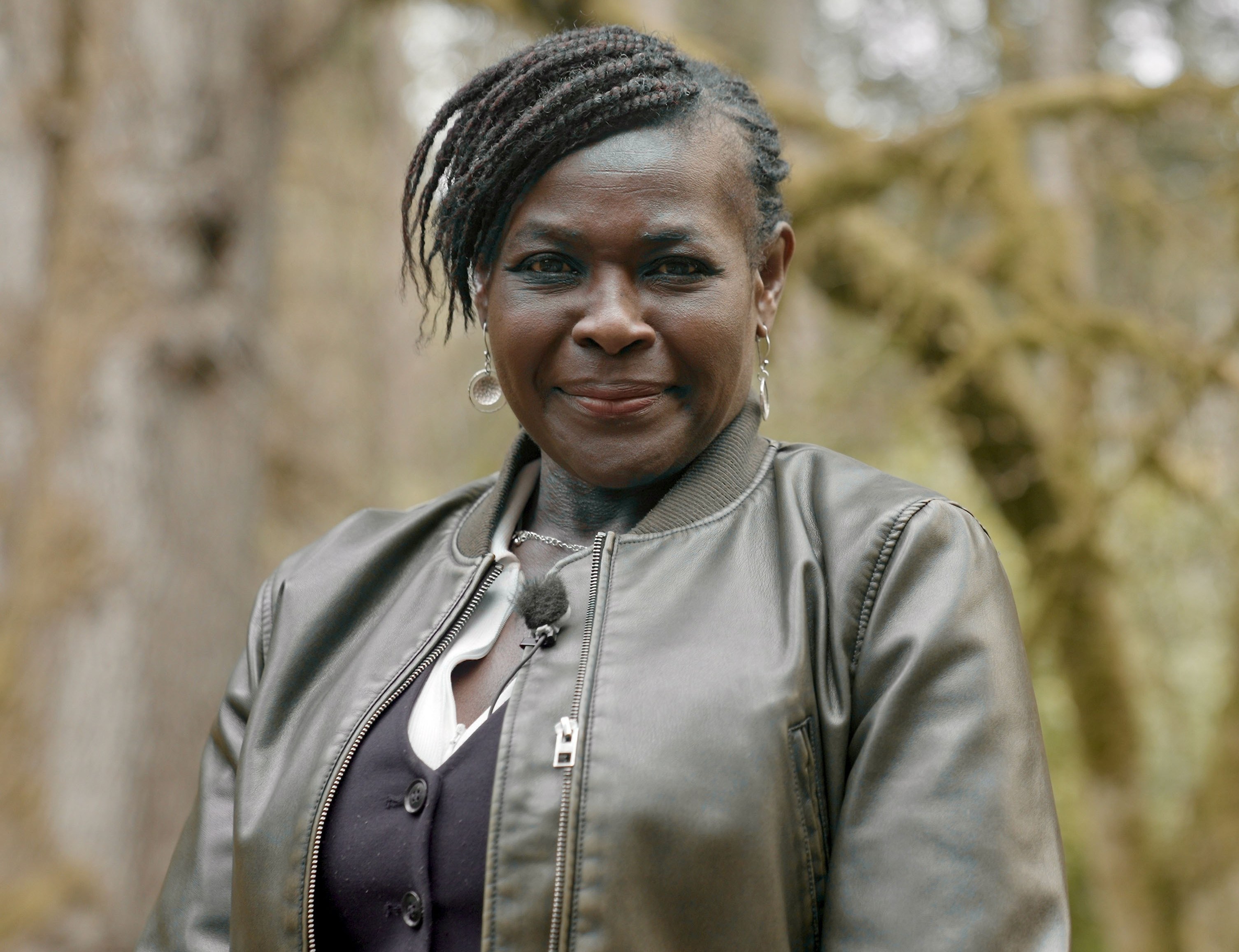 Maggie in a forest comparing early Mars with today's watery Earth.