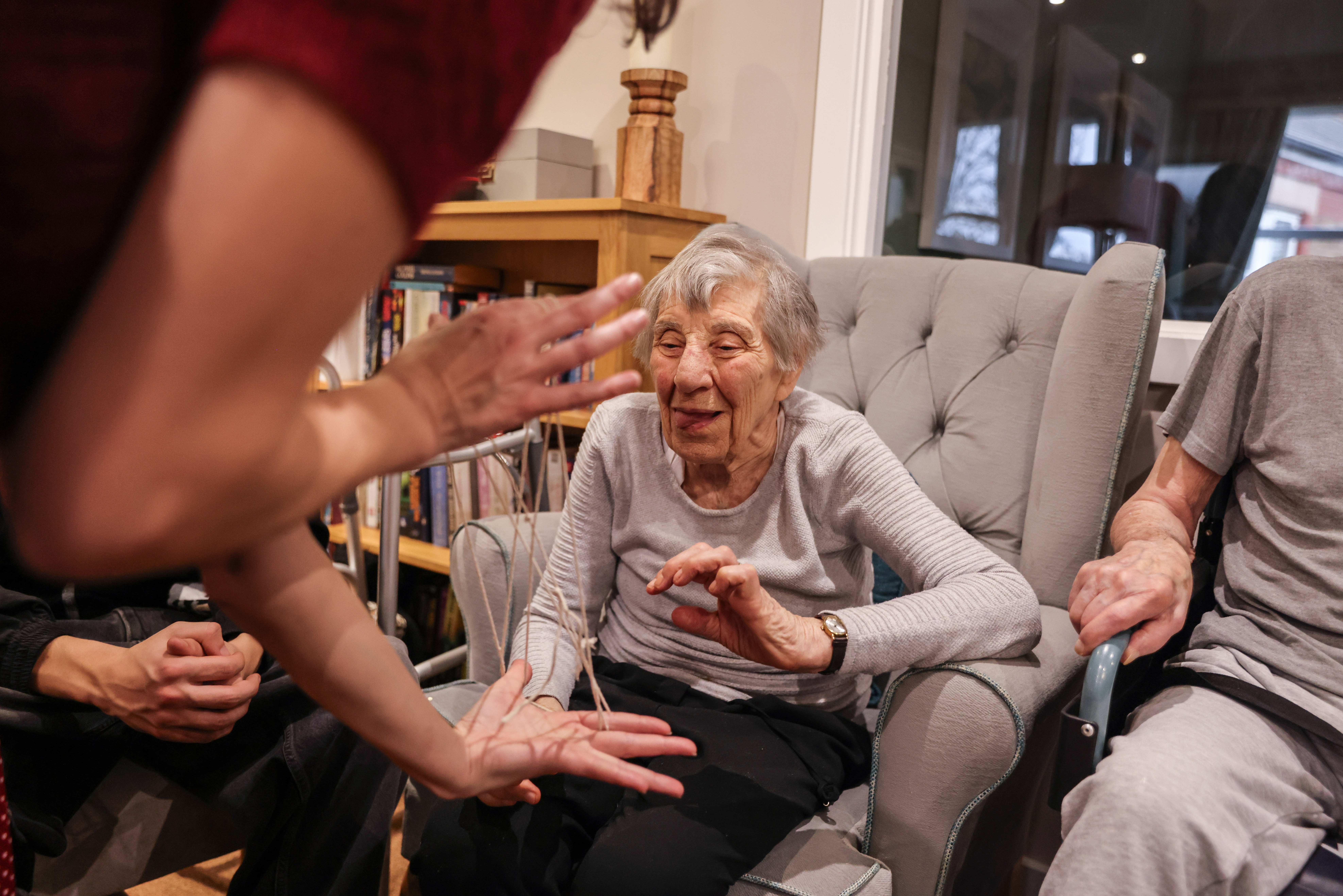 Jeanette Hodes, 92, playing 'cat's cradle'.