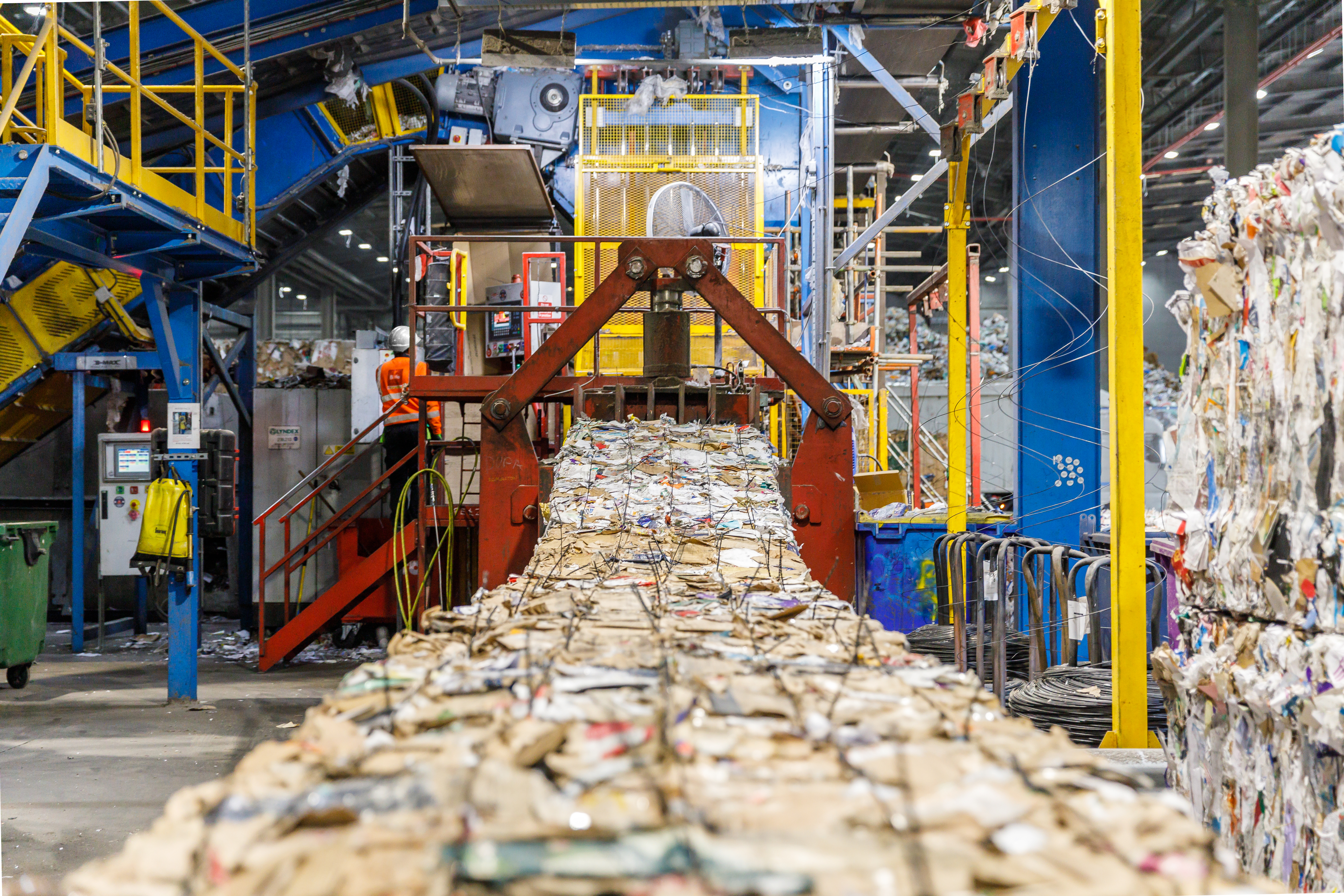Biffa Waste Management plant in Edmonton, north London, showing bales of recycled paper and cardboard.