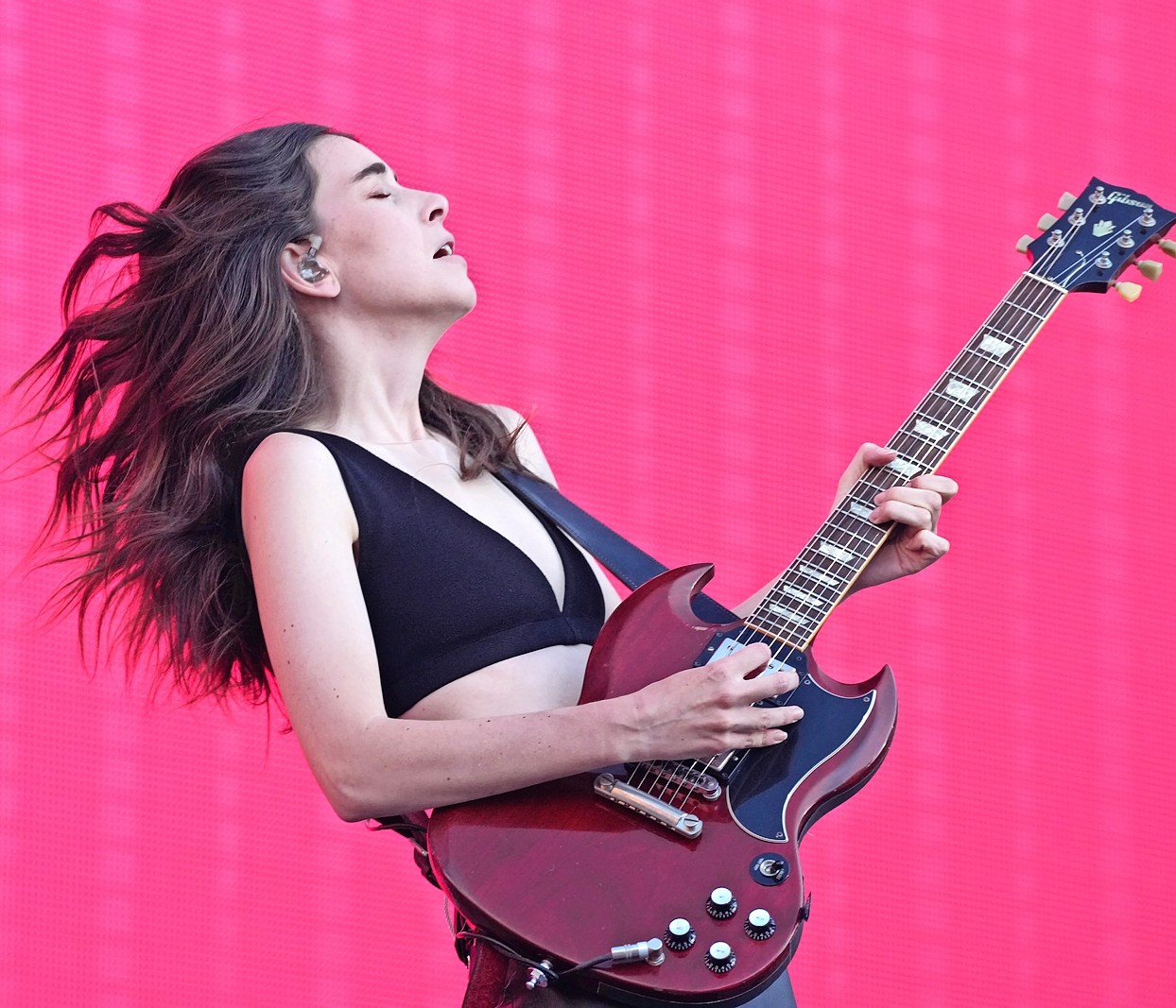 Danielle Haim performing on stage during The Eras Tour.