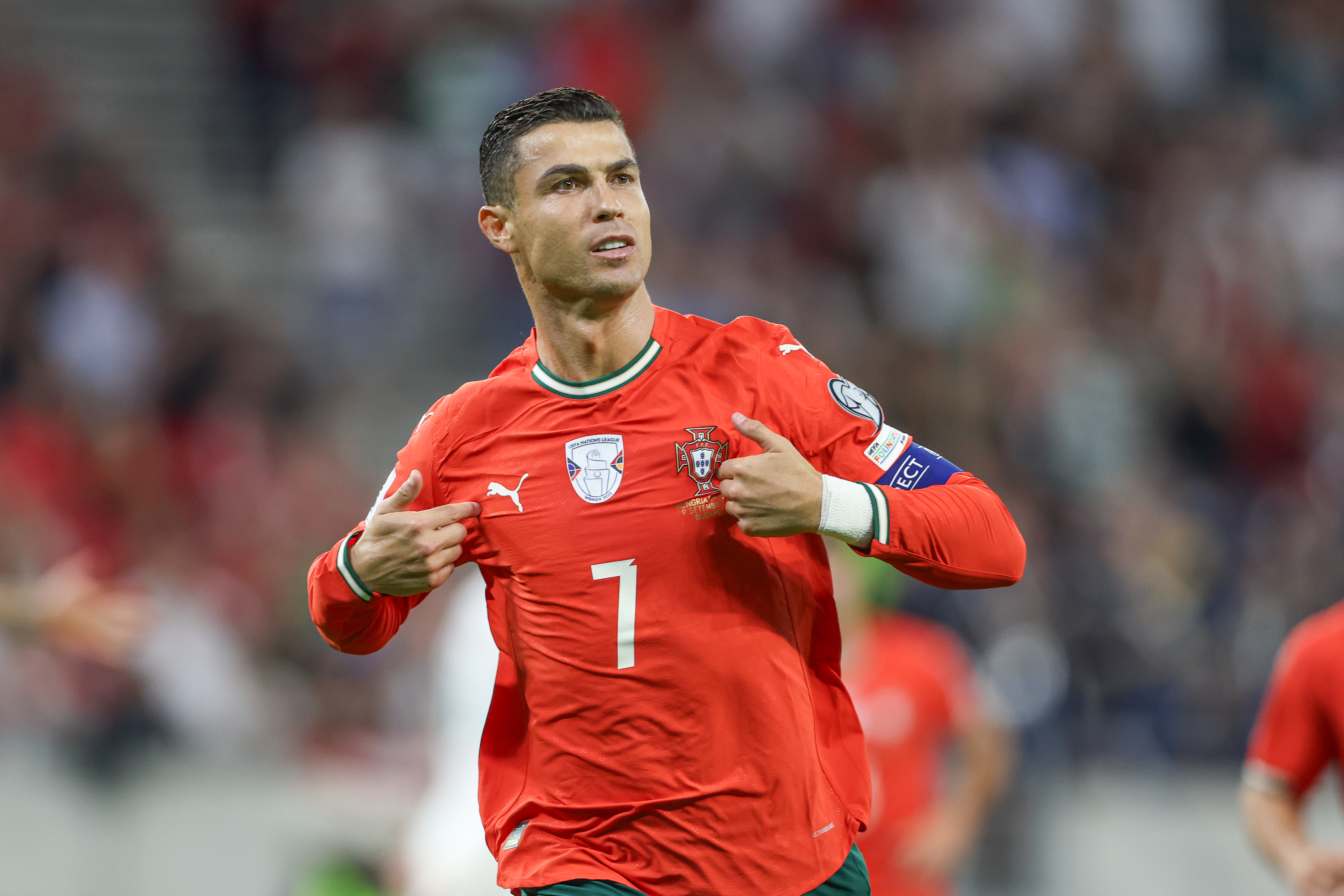 Cristiano Ronaldo celebrating after scoring a goal for Portugal.
