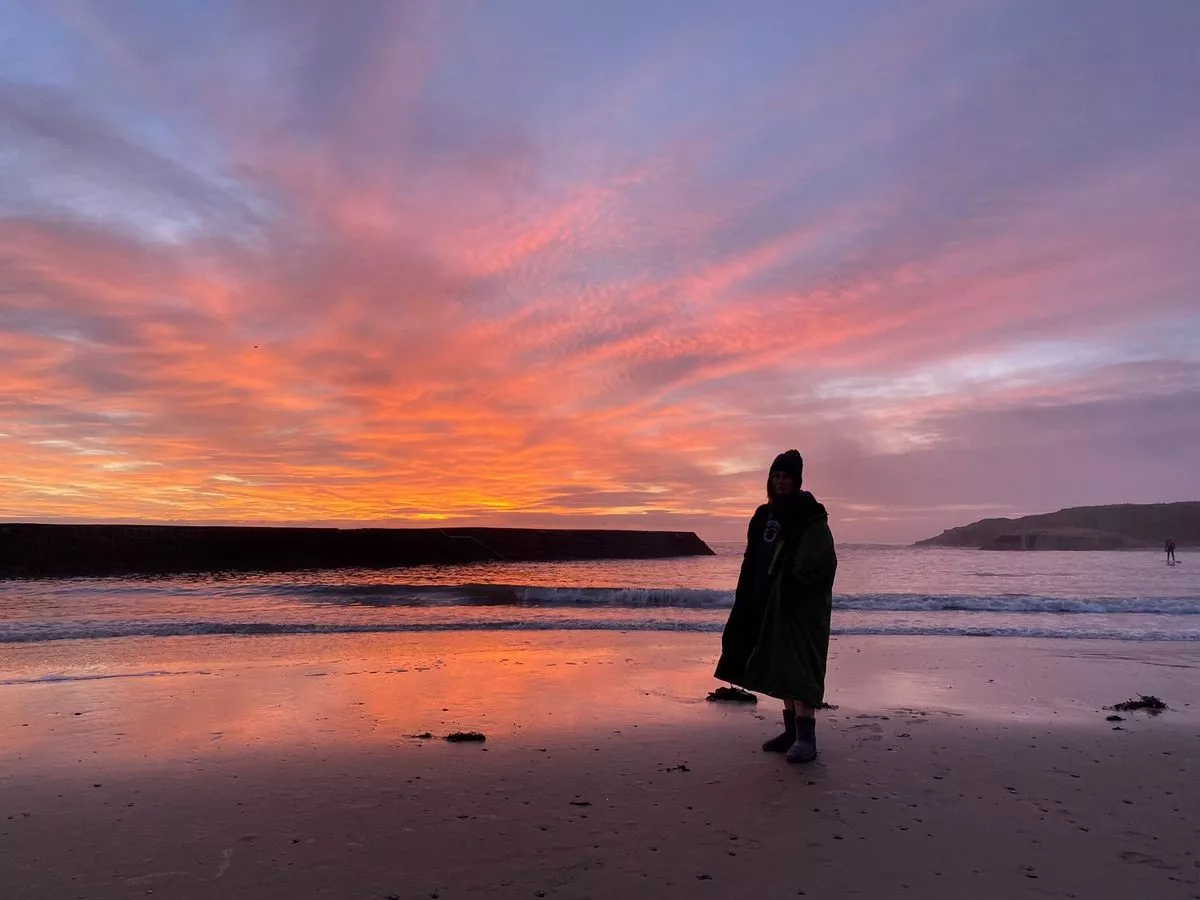 Coreena warms up after a sea swim