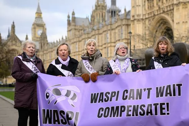 vLONDON, ENGLAND - MARCH 17: A group of women representing the WASPI protest group stand outside the Houses of Parliament during a demonstration on March 17, 2025 in London, England. The Women Against State Pension Inequality (WASPI) organisation is seeking a judicial review after the government said in December it would not pay out compensation, following a Parliamentary Ombudsman's report that found 1950s-born women were not properly informed about changes to state pension age and had suffered injustice.  (Photo by Leon Neal/Getty Images)
