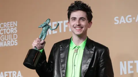 Getty Images Timothée Chalamet poses in the press room with the award for Outstanding Performance by a Male Actor in a Leading Role in a Motion Picture for "A Complete Unknown" during the 31st Annual Screen Actors Guild Awards at Shrine Auditorium and Expo Hall on February 23, 2025 in Los Angeles, California. 