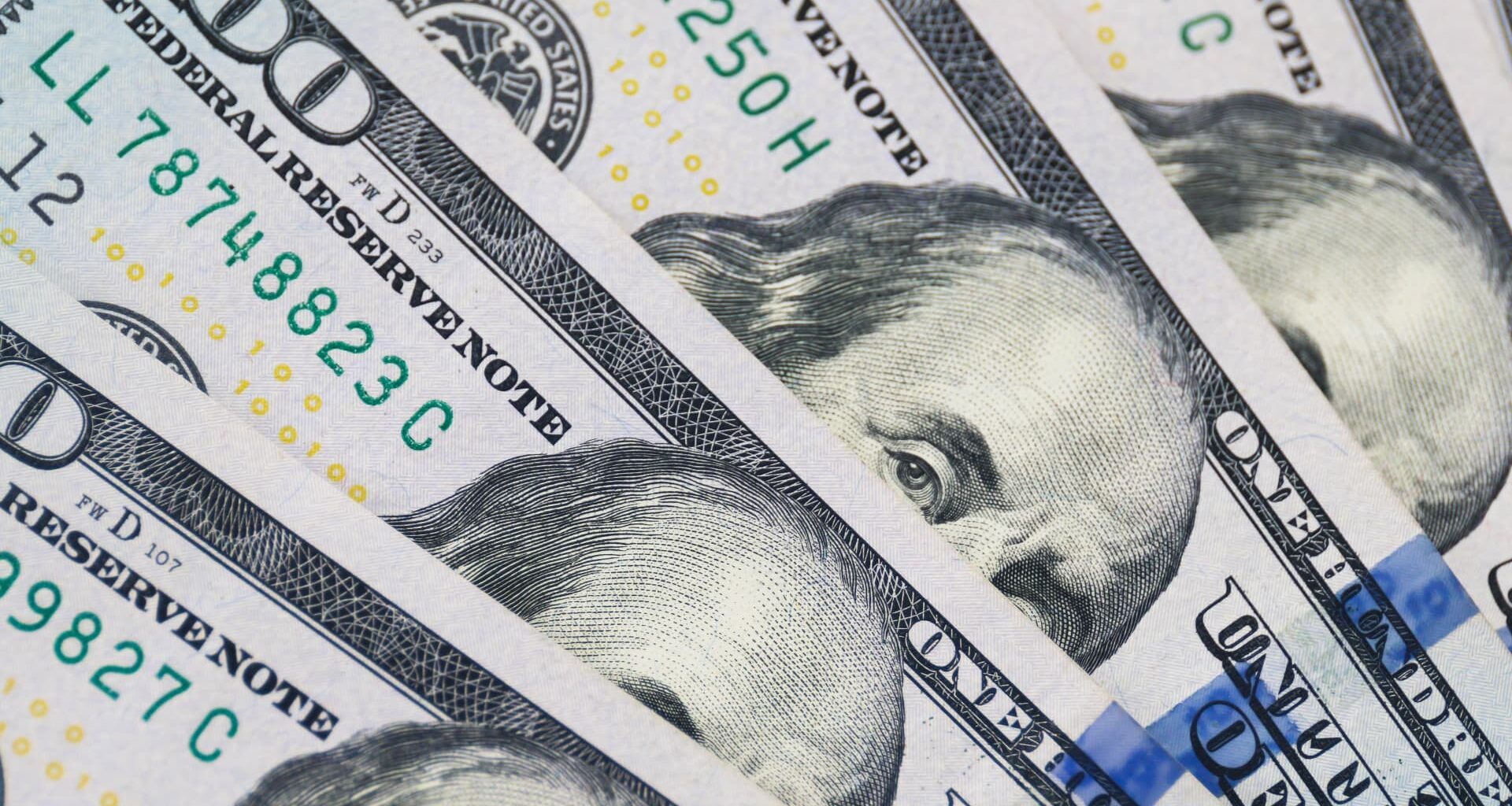 Dollar slides as Fed dents hawks, markets eye two more rate cuts