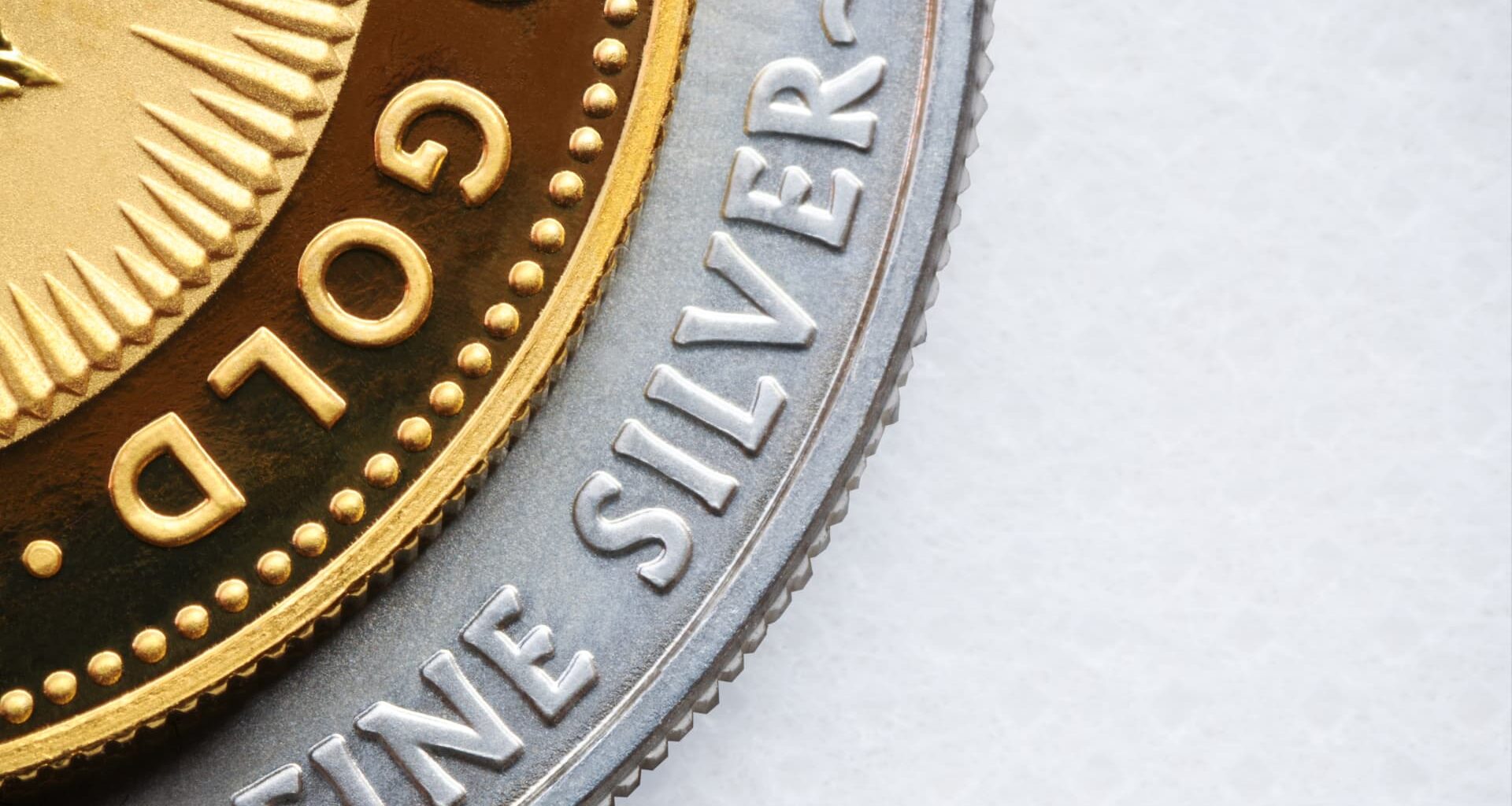 Gold bounces back from two-week low, silver recovers