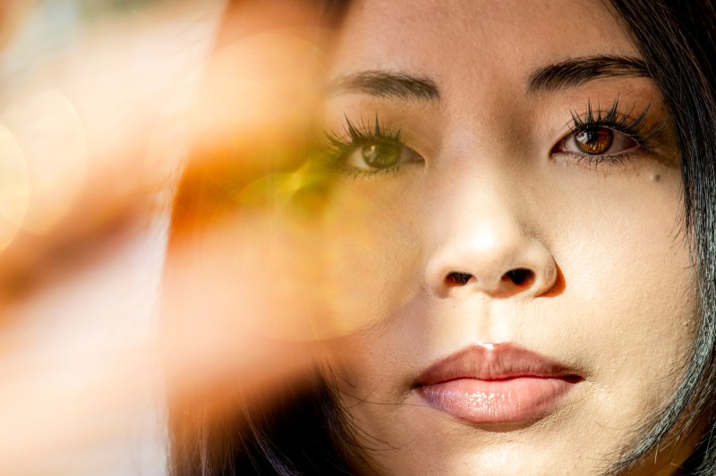 A close up of a face of a young Asian woman.