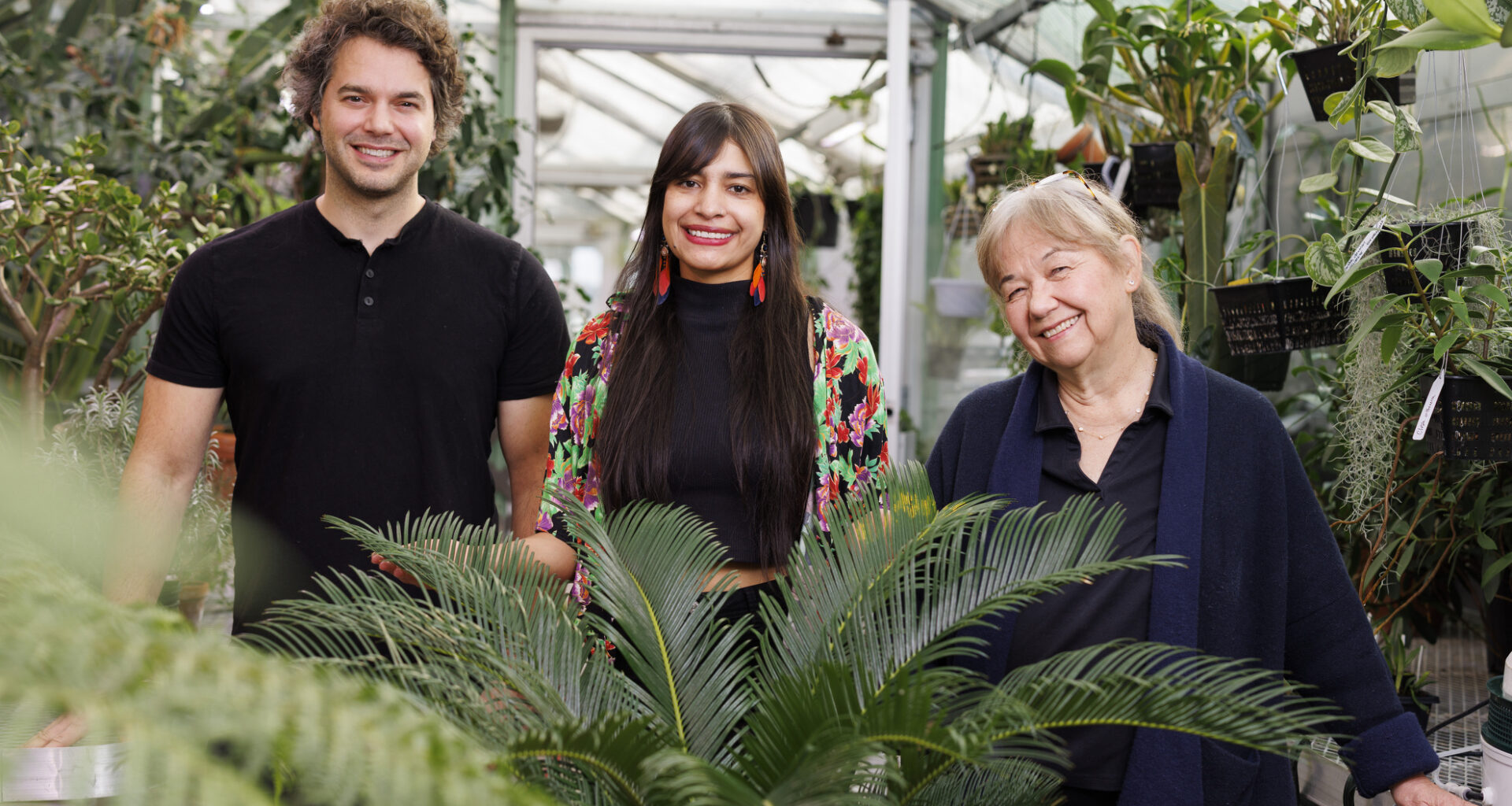 Nicholas Bellono (from left), a professor of Molecular and Cellular Biology, Wendy Valencia Montoya, a junior fellow of the Society of Fellows, and Naomi Pierce, the Sidney A. and John H. Hessel Professor of Biology, are seen near a cycad plant in the Biological Laboratory greenhouse. New research from the group, which will be published in the journal Science, revealed how the plant heats up its reproductive organs to attract beetles, which in turn facilitate pollination. Bellono and Pierce served as advisors for Montoya’s doctoral work, which she recently completed. Pierce is also a senior fellow of the Society of Fellows and curator of lepidoptera. Bellono serves as principal investigator of the Bellono Lab. Veasey Conway/Harvard Staff Photographer