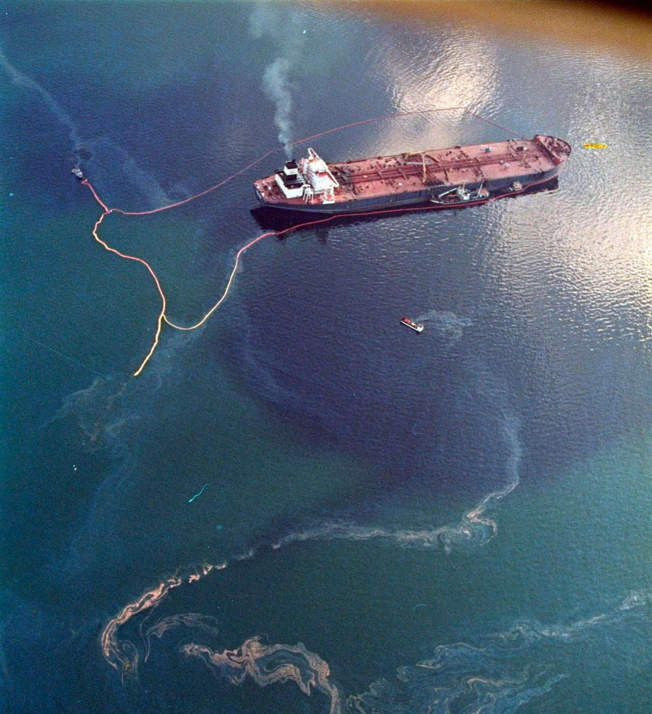 Crude oil from the tanker Exxon Valdez swirls on the surface of water