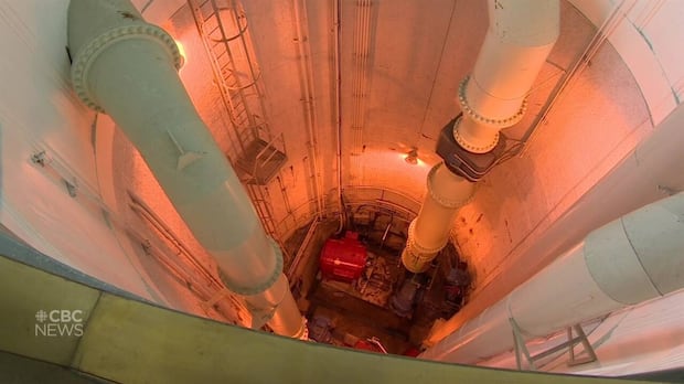 In Winnipeg, a distant light flickers at the end of a sewage-treatment tunnel