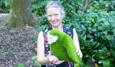 Professor Jacqueline Beggs with a kākāpō soft toy. Photo Rose Davis.