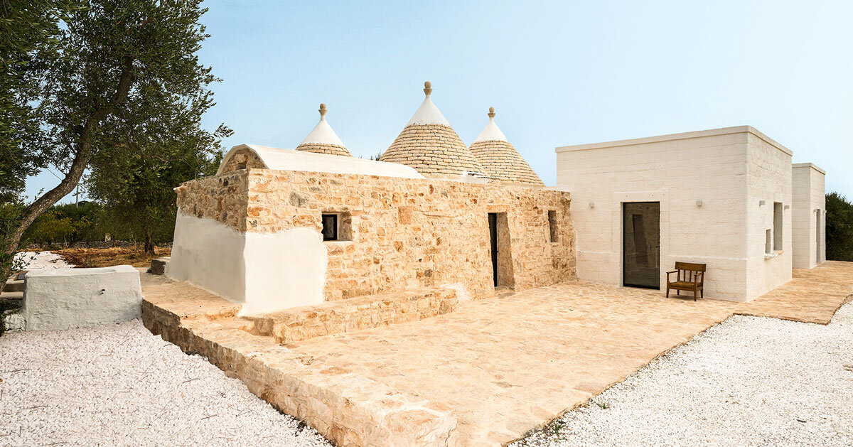 stone-domed trulli fuse with contemporary residence by studio8 in italy